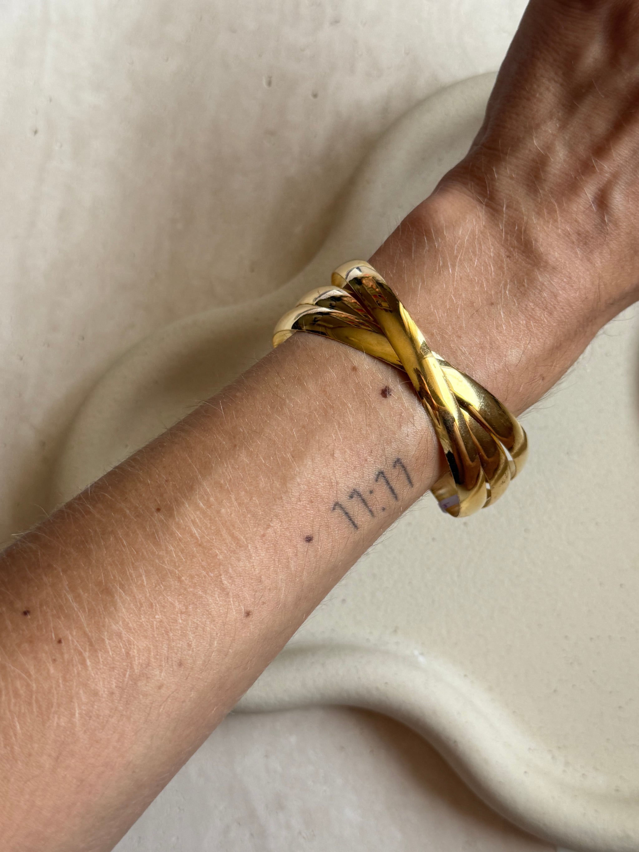 Jonc vintage 3 anneaux dorés entremêlés