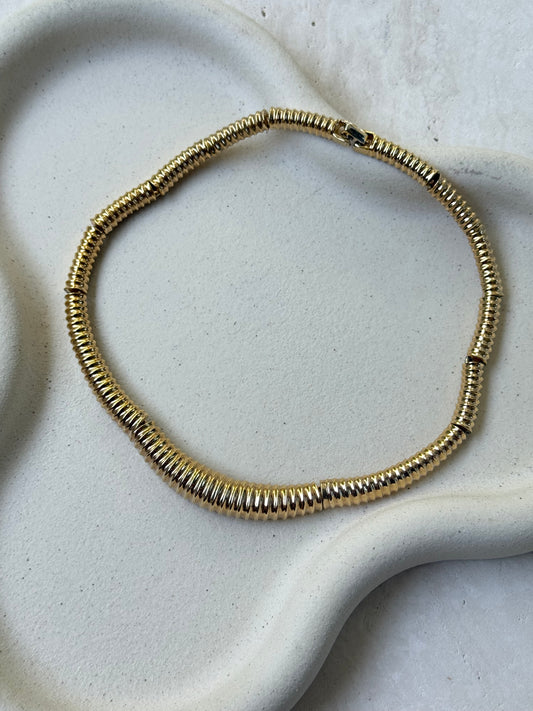 Collier vintage articulé matelassé doré